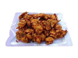 A plate filled with crispy and tasty Pakora - Street Food photo