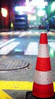 A red and white traffic cone sitting on the side of a road video