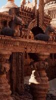 A group of statues displayed on a wooden table in a temple video