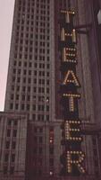 A theater sign on a tall building video