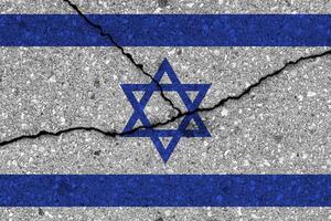 Israel flag on cracked concrete wall. The concept of crisis, default, economic collapse, pandemic, conflict, terrorism, war or other problems in the country. photo