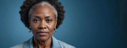 A 50S Adult African American Woman Isolated On A Blue Background With Copy Space. photo