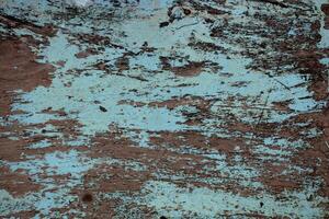 Old wooden walls with cracked and peeling paint photo