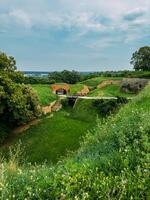 Park with green hills and historical architecture at the Petrovaradin Fortress photo