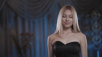 Beautiful girl in a dress laughs at the camera. Blonde smiling at the camera. video