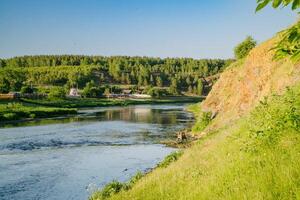 Summer Day Riverside with Hanging Bridge photo