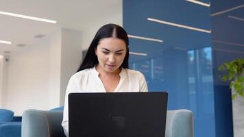 Amazed female professional winner feeling happy receiving new job opportunity, celebrates financial market growth concept. Excited business woman checking email reading great news on laptop video