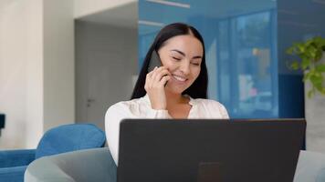 Young business girl working with laptop in coffee shop cafe video