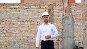 Investor inspect commercial, industrial building construction site. Architect are walking along the building in progress video