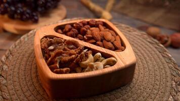 Wooden Bowl Filled With Nuts and Raisins video