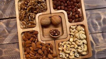 Wooden Tray Filled With Nuts on Table video