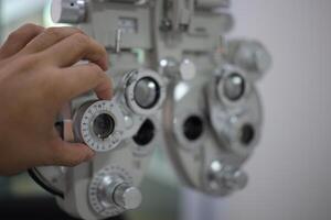 Phoropter eye test in hospital, eye exam photo