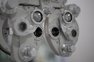 Phoropter eye test in hospital, eye exam photo