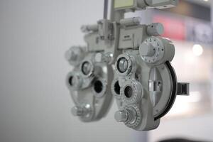 Phoropter eye test in hospital, eye exam photo