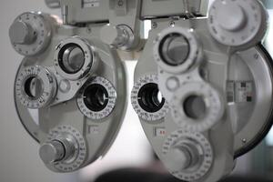 Phoropter eye test in hospital, eye exam photo