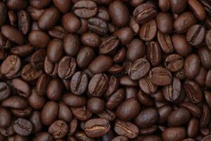 Roasted coffee beans background, brown coffee background photo