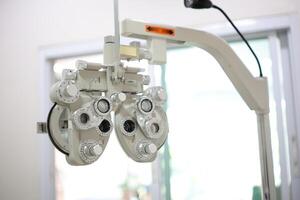 Phoropter eye test in hospital, Eye measurement equipment for patients in hospitals photo