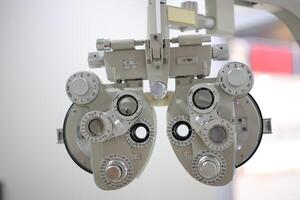 Phoropter eye test in hospital, Eye measurement equipment for patients in hospitals photo