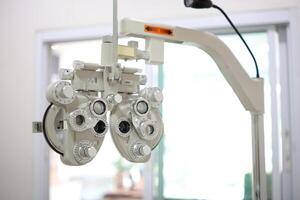 Phoropter eye test in hospital, Eye measurement equipment for patients in hospitals photo