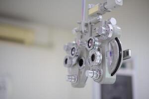 Phoropter eye test in hospital, Eye measurement equipment for patients in hospitals photo
