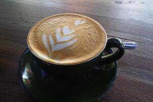 cup of coffee cappuccino on the wooden table photo