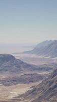 An aerial view of a mountain range in the desert video