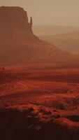 A majestic rock formation in the vast desert landscape captured from above video