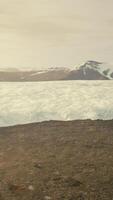 A majestic glacier surrounded by towering mountains video