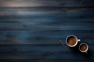 Two cups of coffee and a pencil are on a wooden table photo