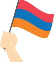 Hand holding and raising the national flag of Armenia vector