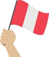 Hand holding and raising the national flag of Peru vector