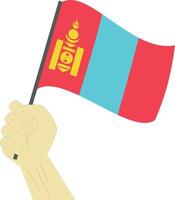 Hand holding and raising the national flag of Mongolia vector