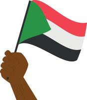 Hand holding and raising the national flag of Sudan vector