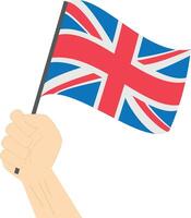 Hand holding and raising the national flag of United Kingdom vector