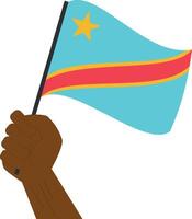 Hand holding and raising the national flag of Democratic Republic of Congo vector