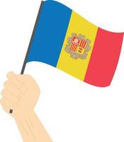 Hand holding and raising the national flag of Andorra vector