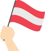 Hand holding and raising the national flag of Austria vector