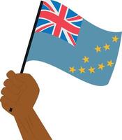 Hand holding and raising the national flag of Tuvalu vector