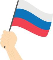 Hand holding and raising the national flag of Russia vector