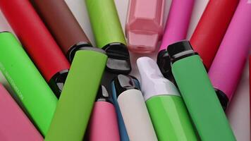 Set Of Colorful Disposable Electronic Cigarettes Of Different Shapes On A White video