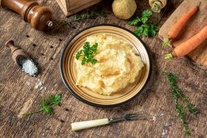 Mashed parsnips with potatoes and carrots photo