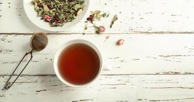 Herbal tea in a white cup photo