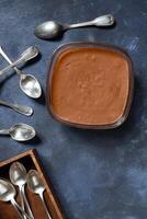 Chocolate mousse on blue background photo