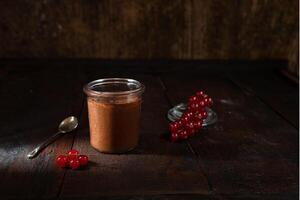 Chocolate mousse in glass and berries photo