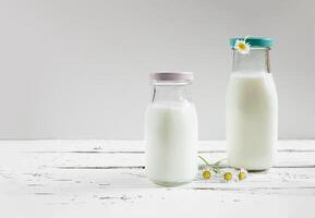Fresh organic milk in bottles photo