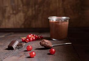 A glass with chocolate mousse photo