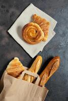 Snail bun, croissants and baguette photo