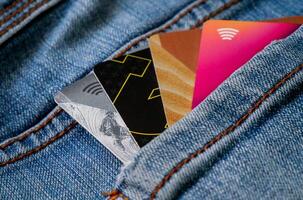 a credit card in the pocket of a pair of jeans photo