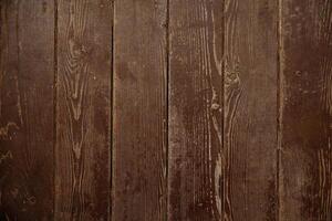 a close up of a wooden wall with a dark brown finish photo