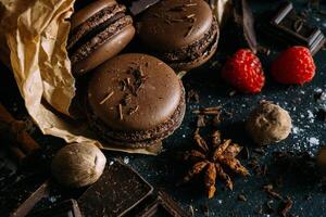 chocolate macarons with raspberries and spices photo